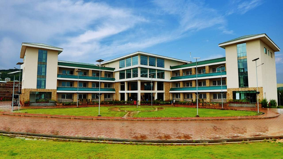 Image of IIM Shillong campus emphasizing its commitment to sustainability and green management.